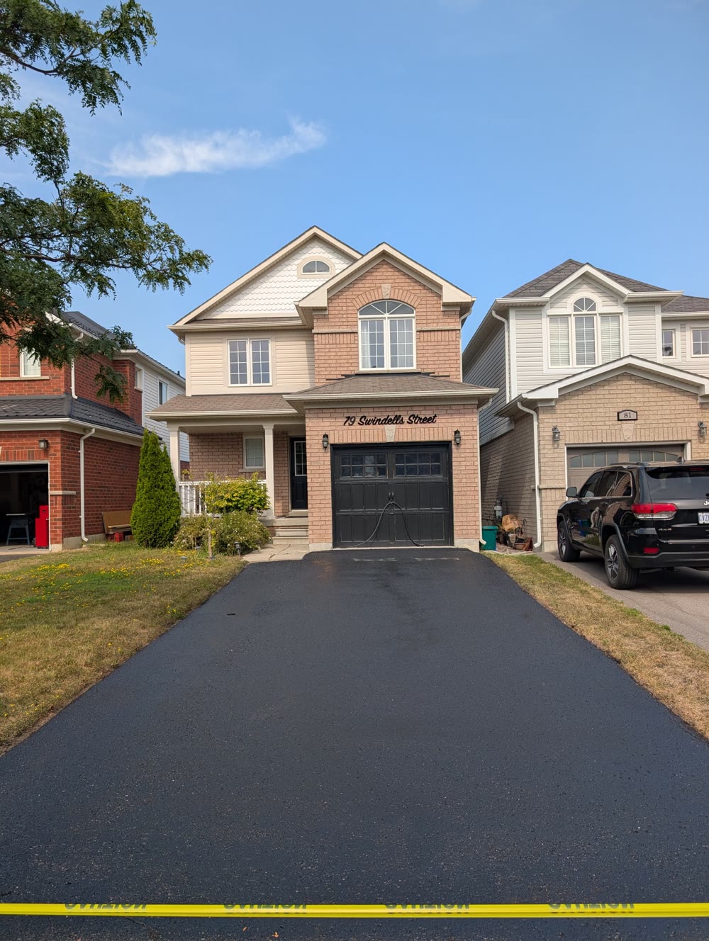 Driveway sealing on a residential street